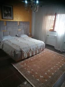 En eller flere senge i et værelse på Maison Blanche Biteng