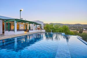 a swimming pool in front of a house at Dar Charkaoui Refugio de Silencio & Hospitalidad Familiar in Tétouan