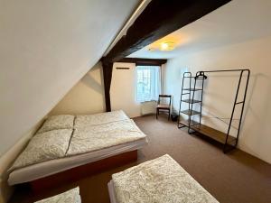 Postel nebo postele na pokoji v ubytování Pension Hraničář