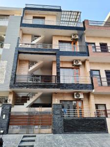 an external view of a building with balconies at Homestay Mohali in Chandigarh Airport