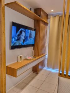 a television on a wall in a room at Best Residence in Rio de Janeiro