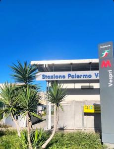a sign for a stanford palomo gas station at Aurea Suites in Palermo