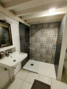 a bathroom with a sink and a shower at La Maison des Amis in Fez +73 photos