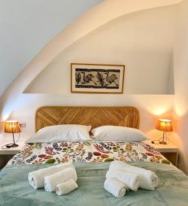 En eller flere senge i et værelse på B&B LE TRE CHIOCCIOLE