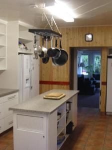 a kitchen with a counter top in a room at HI Penticton - Hostel in Penticton