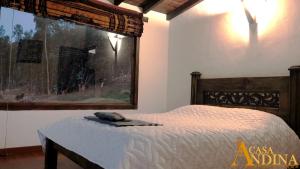 Postel nebo postele na pokoji v ubytování Hostal Casa Lantana
