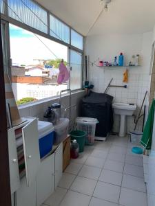 a bathroom with a sink and a toilet at Apto jaraguá lindo in Maceió +9 photos