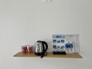 Příslušenství pro přípravu čaje a kávy v ubytování Vy's Home Homestay Mũi Né + 25 fotografií