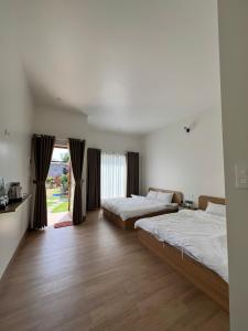 Postel nebo postele na pokoji v ubytování Vy's Home Homestay Mũi Né