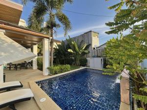 a swimming pool in the backyard of a house at Villa with private pool in Kamala in Kamala Beach