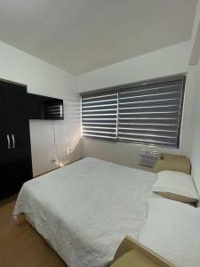 Postel nebo postele na pokoji v ubytování Apartment on Margarita Island edif Lagunablanca Apto 1201
