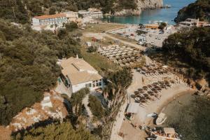 an aerial view of a resort with a beach at Ampelaki Blue in Paleokastritsa