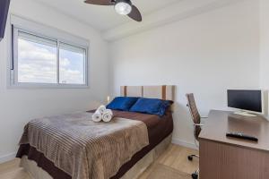 En eller flere senge i et værelse på Apartamento com espaço de trabalho completo - Estação João Dias CPTM