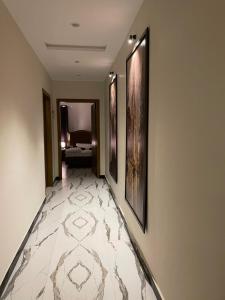 En eller flere senge i et værelse på ASNB Residences 2BHK -F4 + 3 billeder