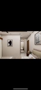 een woonkamer met een bed en een bank bij Hotel Liora Suites in Bangalore +1 foto