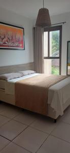 Giường trong phòng chung tại Flat no bosque da praia Pipa-RN