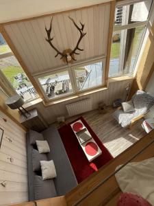 an overhead view of a room with a bed and a table at Studio duplex hyper centre 4 personnes in Le Lioran