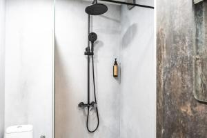 a shower in a bathroom with a toilet at Апартамент 8 in Lovech