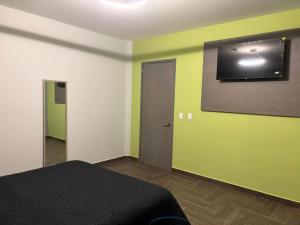 Et tv og/eller underholdning på Hotel Azomali plus