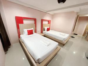 En eller flere senge i et værelse på Krabi Serene Loft