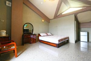 Postel nebo postele na pokoji v ubytování Jheng Tong House