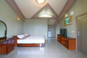 Postel nebo postele na pokoji v ubytování Jheng Tong House