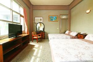 TV a/nebo společenská místnost v ubytování Jheng Tong House