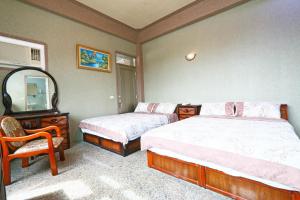 Postel nebo postele na pokoji v ubytování Jheng Tong House