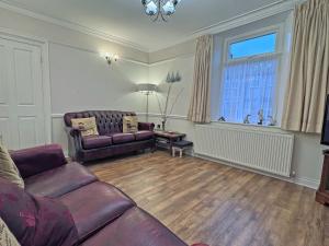 Et opholdsområde på Seaview Cottage