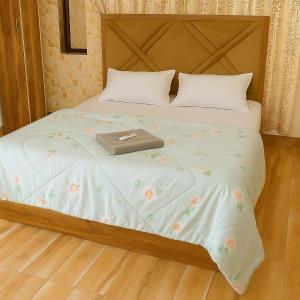 Giường trong phòng chung tại ll SUKOON VILLA ll