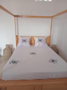 Giường trong phòng chung tại Residence wa maore