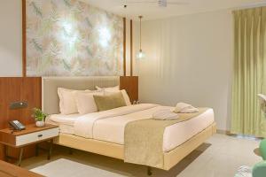 Giường trong phòng chung tại Len R Inn