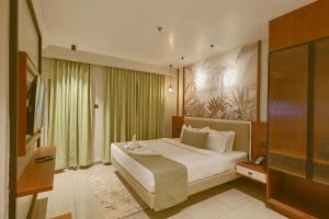 Giường trong phòng chung tại Len R Inn +12 ảnh