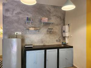 a kitchen with a counter and a sink in it at Florin Studio in Vagator