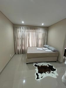 En eller flere senge i et værelse på Ollet Heights - Ocean View