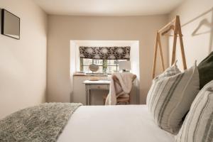 En eller flere senge i et værelse på Coniston House - Eco Hot Tub