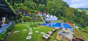 an aerial view of a backyard with a swimming pool at Adelisca Glamping, Cafe and Villa in Kubupenlokan