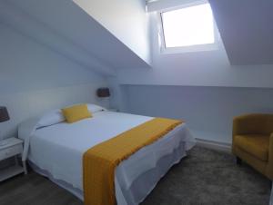 Postel nebo postele na pokoji v ubytování QUO Almeida Garrett