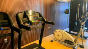 a room with a gym with a treadmill at W Tambaú Apart Hotel in João Pessoa