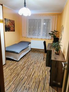 En eller flere senge i et værelse på Wolkrova city stay