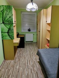 En eller flere senge i et værelse på Wolkrova city stay + 16 billeder