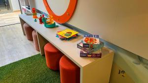 a dressing table with orange chairs and a mirror at W Tambaú Apart Hotel in João Pessoa +70 photos