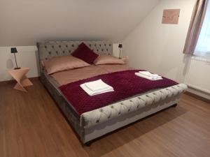 En eller flere senge i et værelse på President Apartmanház