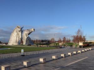 a large statue of a dog in a park at Beechtree Timber Lodge 69B in Denny