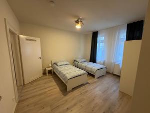 En eller flere senge i et værelse på Offenbach Work & Sleep
