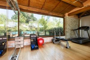 a room with a gym with a large window at Villa Sant 'Angelus in Canonica