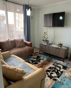 Et opholdsområde på COMODO DEPTO FAMILIAR 3D 1B PARKING Piscina