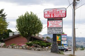 a sign for a burger inn and suites on a street at Best Budget Inn & Suites Kamloops in Kamloops