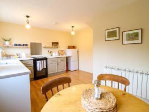 a kitchen and dining room with a table and chairs at 2 Horseshoe Road in Montgomery +15 photos