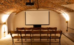 a group of chairs in a room with a whiteboard at Wren Place Hall in Barnsley